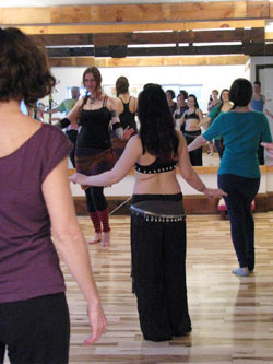 Portland Maine belly dance teacher Joie Grandbois with her students